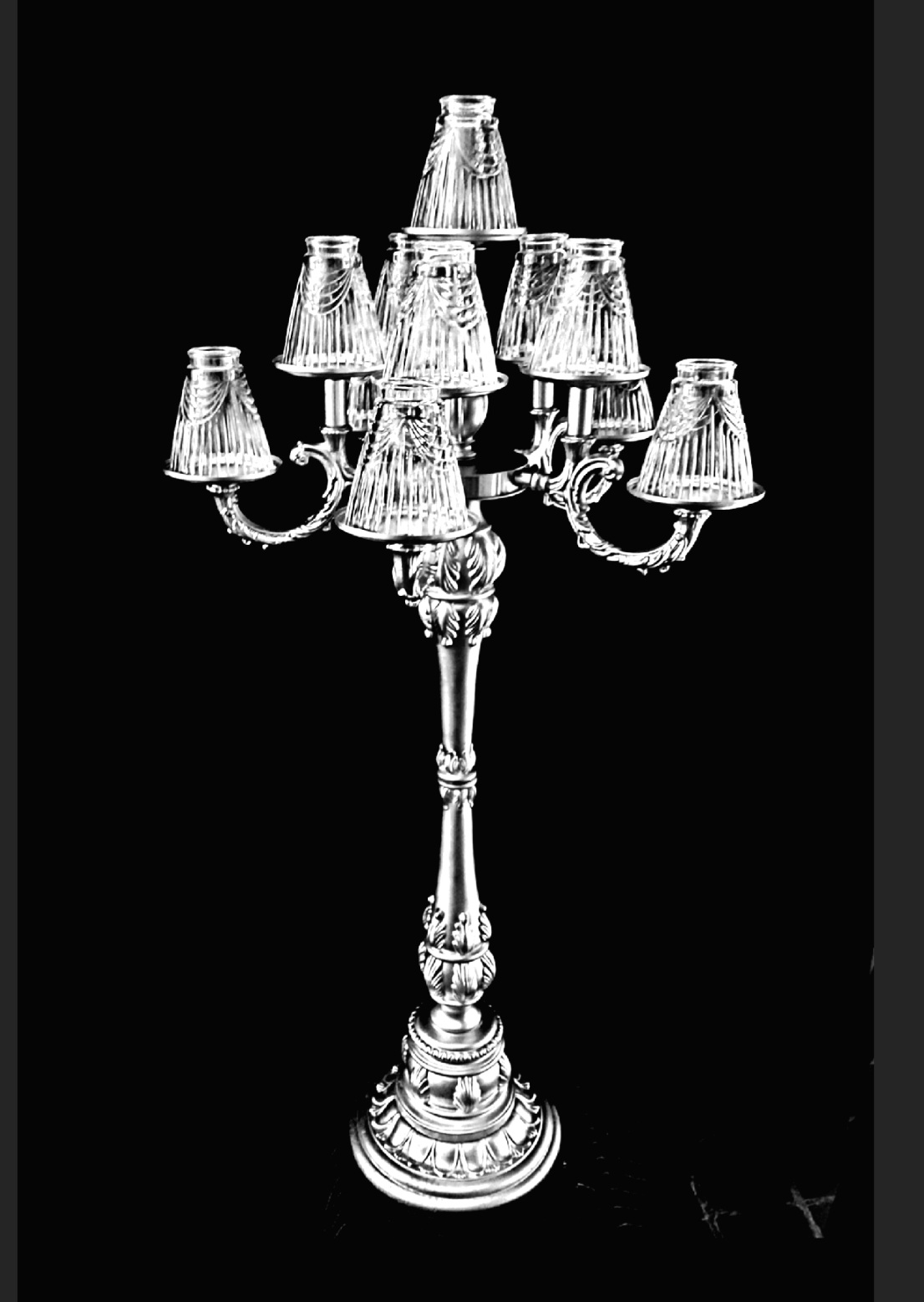 New-style silver candelabra with crystal lamp shades.11 candles .Base 12 inches, height of 50 inches.