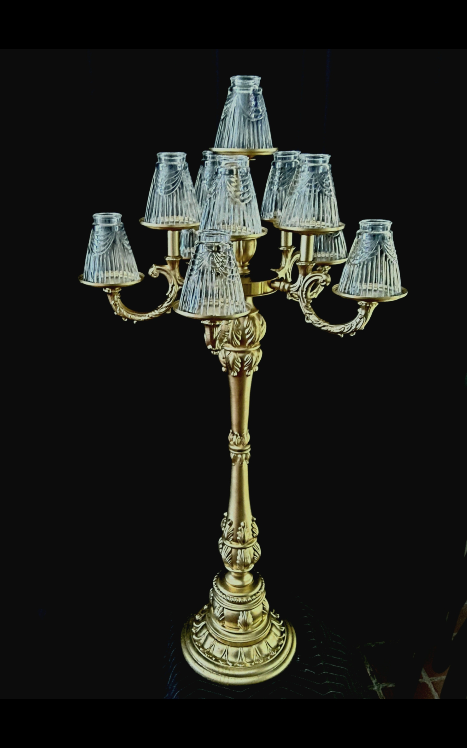 New-style  gold candelabra with crystal lamp shades.11 candles.. Base 12 inches, height of 50 inches.